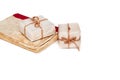 Gift books beautifully wrapped and bandaged with ribbon bow on a white background .