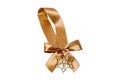 Gift bows. Closeup of a decorative golden ribbon bow made of silk for gift box isolated on a white background. Decorations