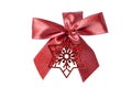 Gift bows. Closeup of a decorative red ribbon bow made of silk for gift box isolated on a white background. Decorations background Royalty Free Stock Photo