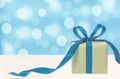 Gift box against bokeh background. Royalty Free Stock Photo