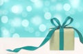 Gift box against bokeh background. Holiday present. Festive gift Royalty Free Stock Photo