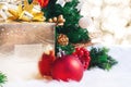 Gift box and ball decoration under christmas tree on white fer w Royalty Free Stock Photo