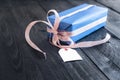 Gift box with a blank tag Royalty Free Stock Photo