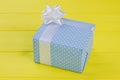 Gift box in blue patterned paper. Royalty Free Stock Photo