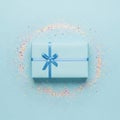 Gift Box with Blue Ribbon and Confetti Royalty Free Stock Photo