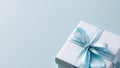 Gift box with blue satin bow with space for text. Royalty Free Stock Photo