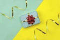 Gift box with a bow on a bright background. Royalty Free Stock Photo