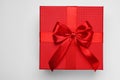 Gift box with bow on light grey background, top view Royalty Free Stock Photo