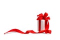 Gift box with a bow made of red satin ribbon, isolate on a white background Royalty Free Stock Photo