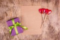 Gift box and candy hearts. Romantic concept. Lollipops on heart shaped stick and box with ribbon.