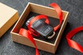 Gift box with car keys with remote control alarm system with red ribbon bow. Royalty Free Stock Photo