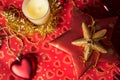 Gift in box with christmas decoration at red background Royalty Free Stock Photo