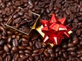 Gift box in coffee beans Royalty Free Stock Photo