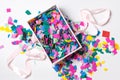A gift box with colorful confetti. The view from the top. Close-up Royalty Free Stock Photo