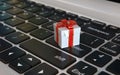 Gift box 3d icon on laptop keyboard, 3d rendering Royalty Free Stock Photo