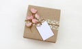 Gift box with empty tag mockup, flowers Royalty Free Stock Photo