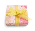 Gift box with festive floral prints and golden ribbon bow