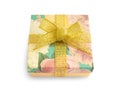 Gift box with festive floral prints and golden ribbon bow