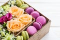 Gift box with flowers and macaroon Royalty Free Stock Photo