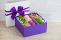 Gift box with flowers and macaroon Royalty Free Stock Photo