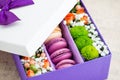 Gift box with flowers and macaroon Royalty Free Stock Photo