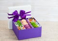 Gift box with flowers and macaroon Royalty Free Stock Photo