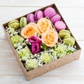 Gift box with flowers and macaroon Royalty Free Stock Photo