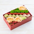 Gift box with flowers and macaroon Royalty Free Stock Photo