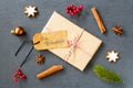 Gift box with a Frohe Weihnachtsfest - Merry Christmas tag on it on the table with decorations Royalty Free Stock Photo