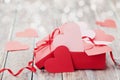 Gift box full of hearts on wooden background for Saint Valentines Day