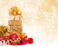 Gift box in gold wrapping paper Royalty Free Stock Photo