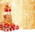 Gift box in gold wrapping paper Royalty Free Stock Photo