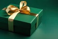 Gift box with golden satin ribbon and bow on green background. Generative AI Royalty Free Stock Photo