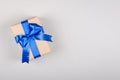 Gift box on gray background composition, present with ribbon and bow Royalty Free Stock Photo