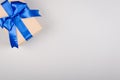 Gift box on gray background composition, present with ribbon and bow Royalty Free Stock Photo