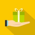 Gift box in hand icon, flat style Royalty Free Stock Photo