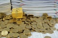 Gift box in heap of gold coins Royalty Free Stock Photo