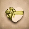 Gift Box Heart With Green Bow On Brown Background. Royalty Free Stock Photo