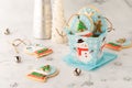 A gift box of homemade snow globe cookies with more cookies all around. Royalty Free Stock Photo