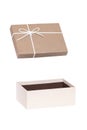 Gift box isolated. Close-up of a beige opened present or gift box with white ribbon bow isolated on a white background. Birthday, Royalty Free Stock Photo