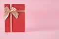 Gift box on an isolated pink background. Rectangular gift box