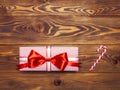 Gift box with lollypop on the wooden board Royalty Free Stock Photo