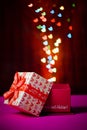 Gift box open shaped heart with Defocused bokeh colorful lights Royalty Free Stock Photo