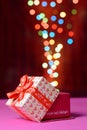 Gift box open shaped heart with Defocused bokeh colorful lights Royalty Free Stock Photo