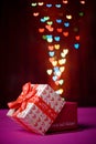 Gift box open shaped heart with Defocused bokeh colorful lights Royalty Free Stock Photo