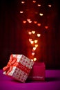 Gift box open shaped heart with Defocused bokeh colorful lights