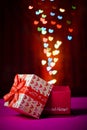 Gift box open shaped heart with Defocused bokeh colorful lights Royalty Free Stock Photo