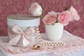 Gift box, pearls, wedding rings and roses Royalty Free Stock Photo