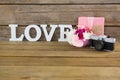 Gift box, photo frame, vintage camera and flower vase Royalty Free Stock Photo