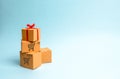 A gift box on a pile of boxes. The concept of finding the perfect gift. Limited offer Buy a gift on time. Sale, big discounts Royalty Free Stock Photo